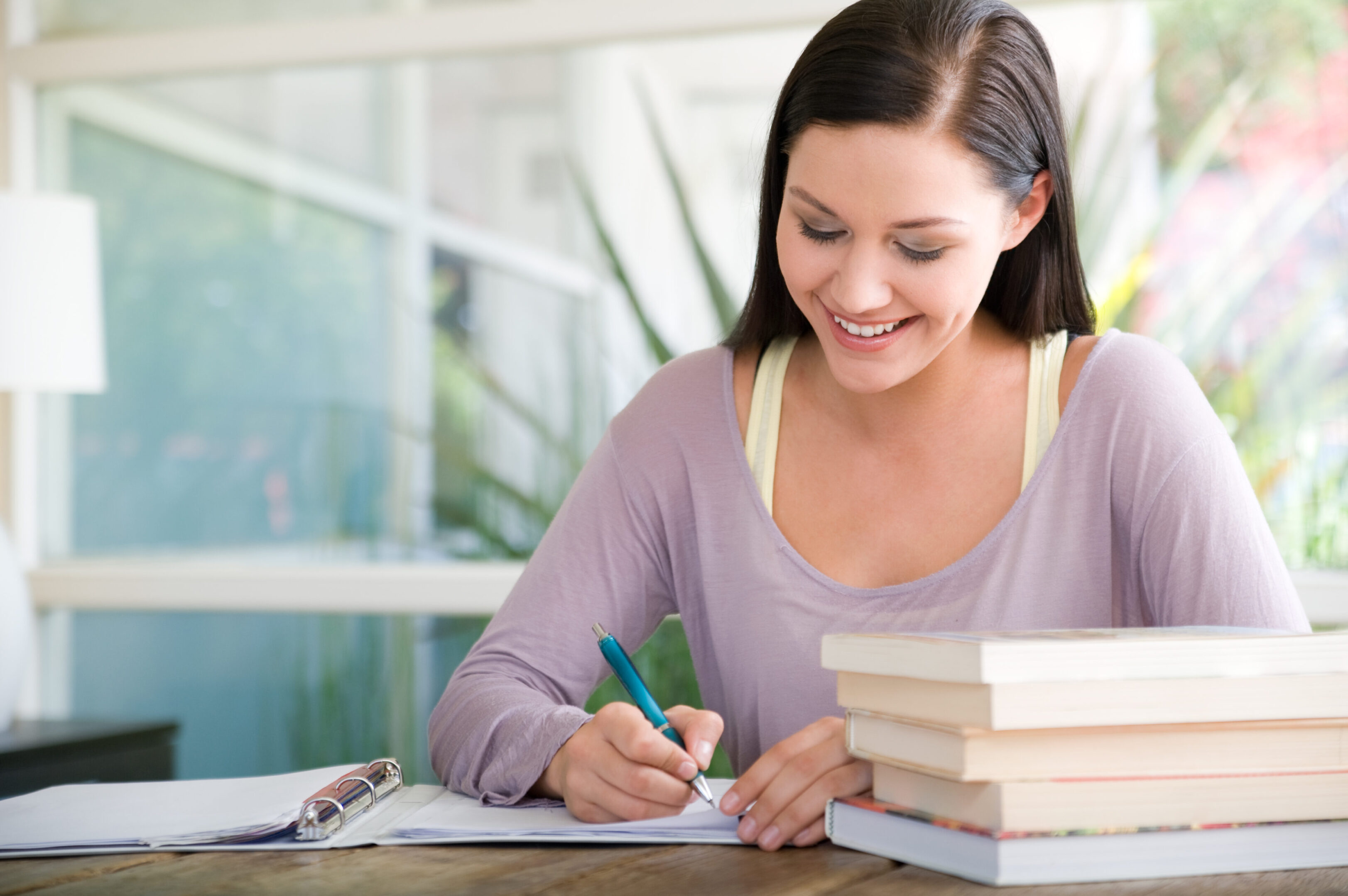 A woman working on her studies.